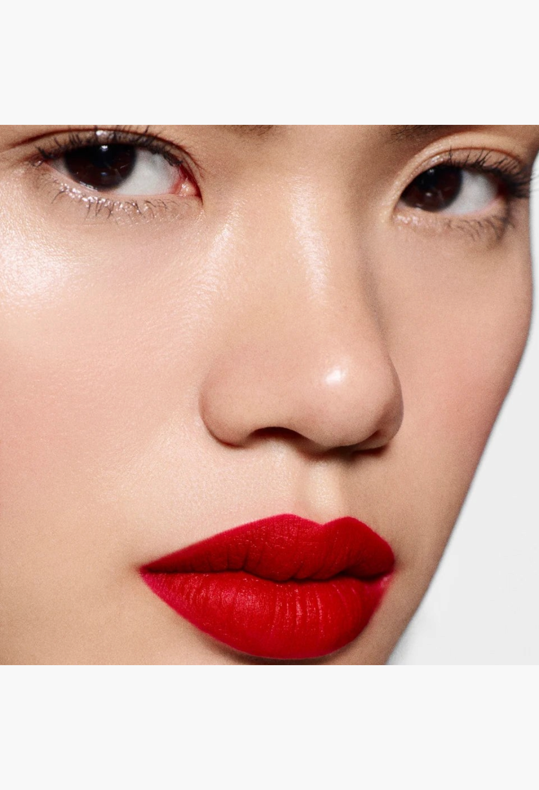 GLAM MODA Rouge Victoria matte red lipstick applied on a model with a smooth, vibrant, and velvety finish.