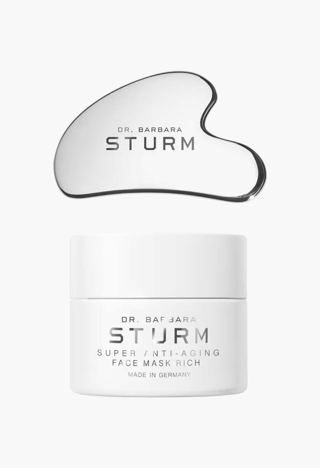 GLAM MODA Dr. Barbara Sturm Super Anti-Aging Face Mask Rich jar and silver gua sha tool on a white background.