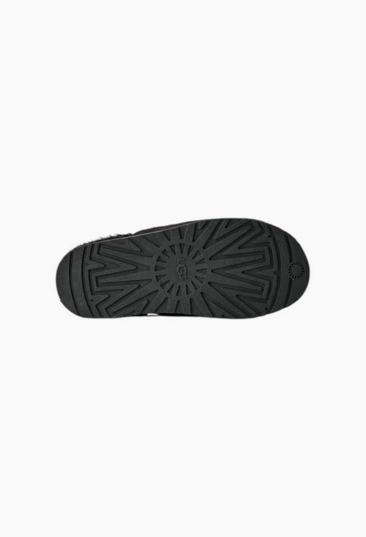 GLAM MODA Otzo calf hair clog showing the black textured rubber outsole with UGG logo branding.