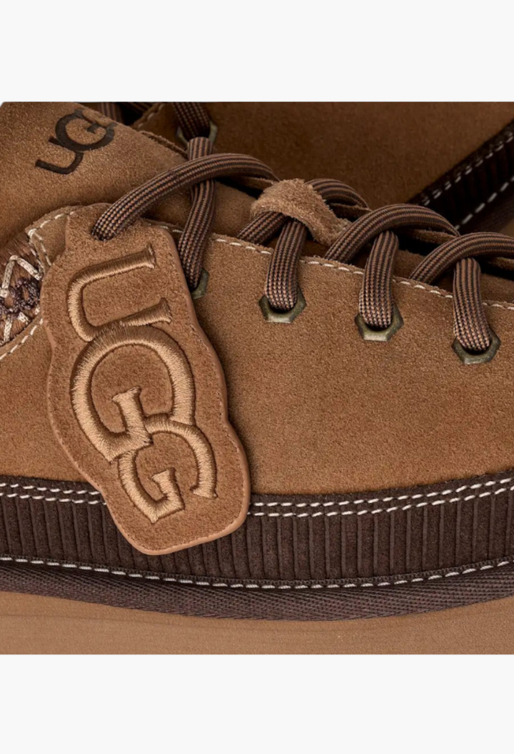 GLAM MODA brown suede lace-up slipper featuring a removable mini UGG boot charm and detailed stitching