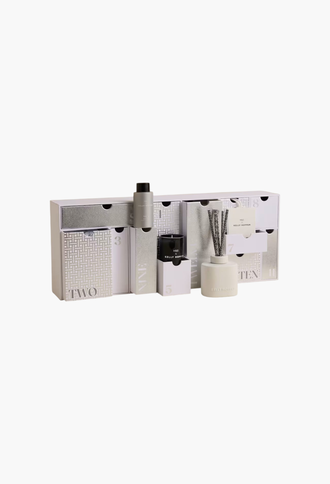 GLAM MODA 12 Days of Wellness Advent Calendar featuring luxury candles and home fragrance items in silver and white.