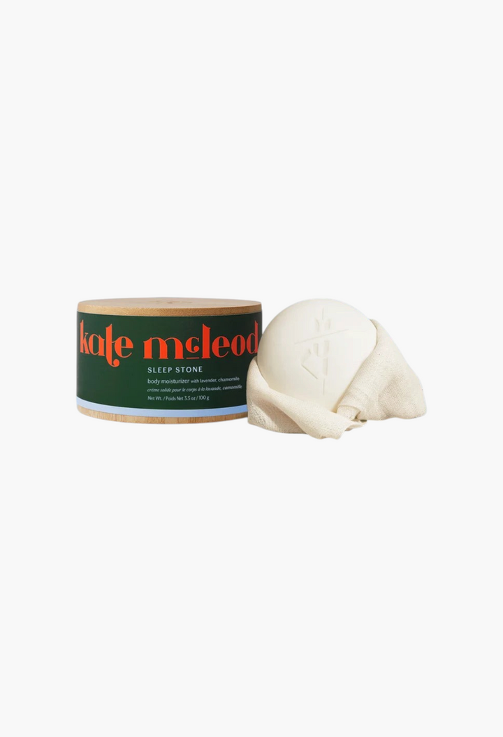 GLAM MODA Sleep Stone moisturizing lotion bar with lavender and chamomile in a round bamboo container.