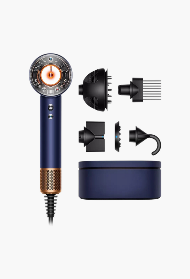 GLAM MODA Dyson Supersonic Nural hair dryer in blue with copper accents, including five attachments and storage case.