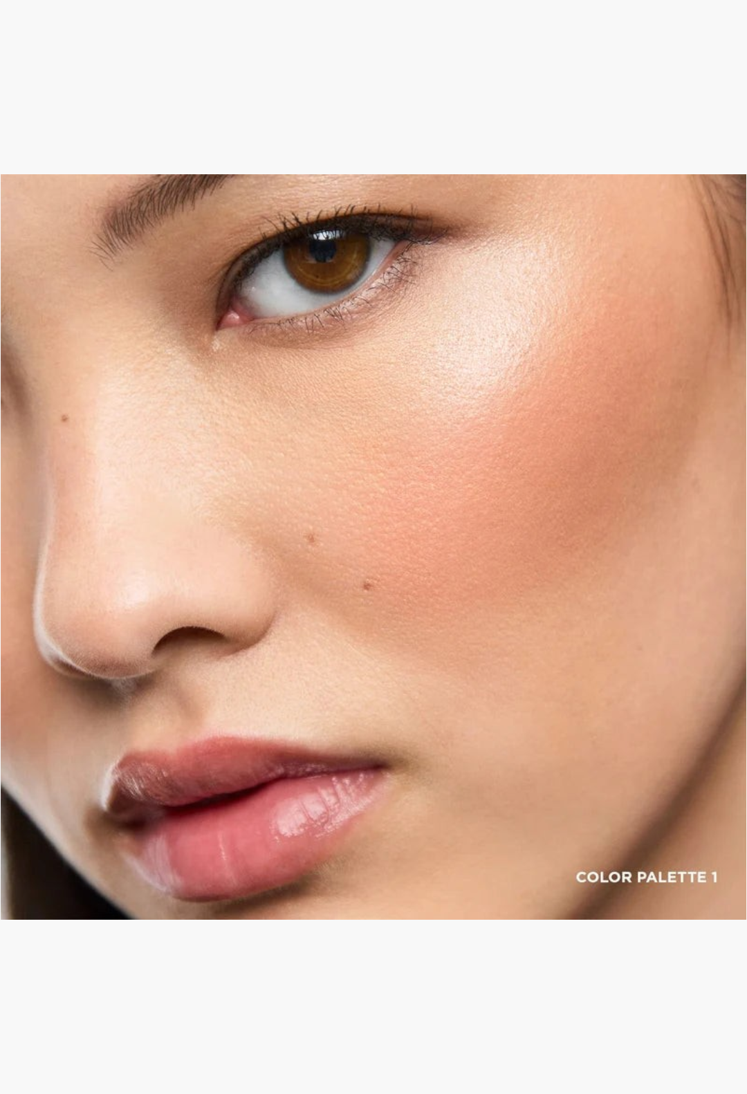 GLAM MODA Ambient Lighting Edit Unlocked Palette 1 applied to a model's cheek for a radiant, soft-glow finish.