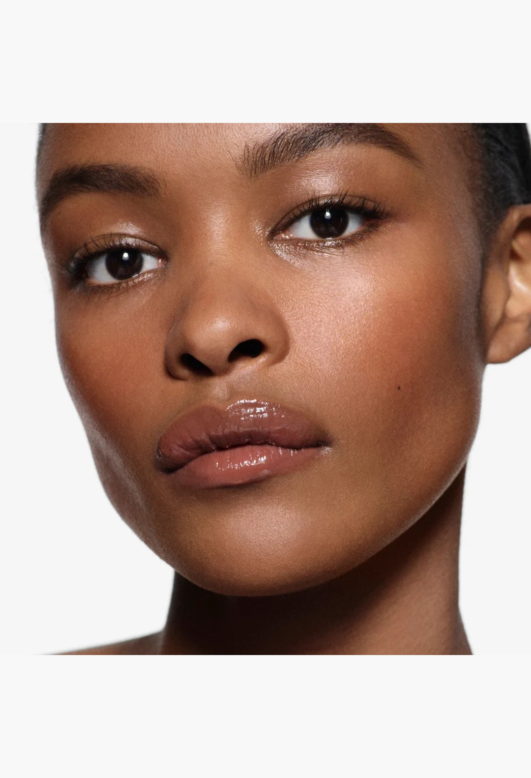 GLAM MODA Posh Gloss High Shine Lip on a model with a natural makeup look, featuring a glossy, hydrated finish.