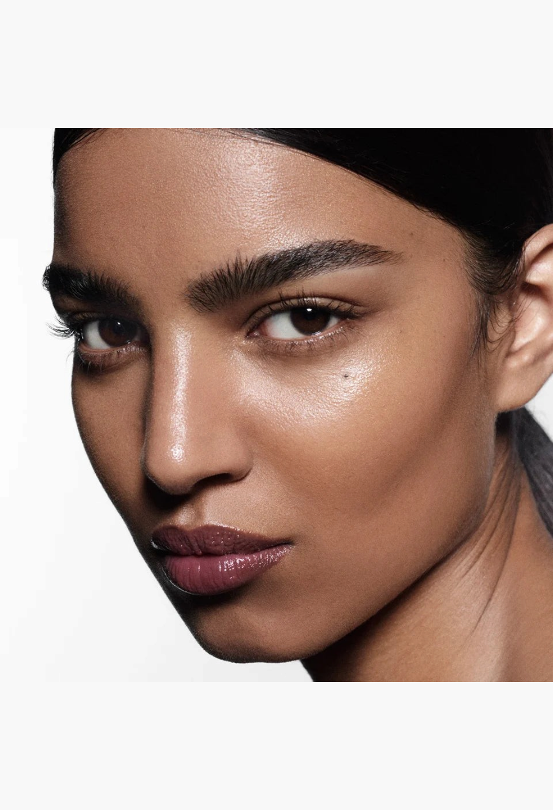 GLAM MODA Posh Balm Nourishing Lip Shine on a model with a glossy, hydrated, and tinted lip finish.