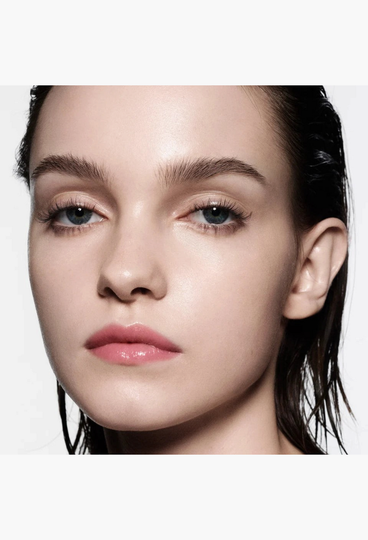 GLAM MODA Posh Balm Nourishing Lip Shine on a model with a natural, glossy pink finish and hydrated, smooth lips.