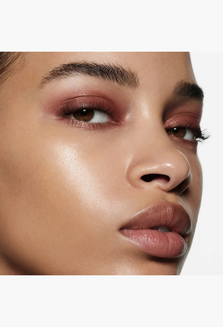 GLAM MODA Eye Wardrobe eyeshadow palette applied on a model with a warm, shimmering brown and tan smoky eye look