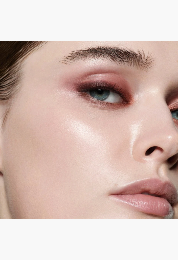 GLAM MODA Eye Wardrobe eyeshadow palette applied on a model, featuring warm brown and bronze tones on the eyelids.
