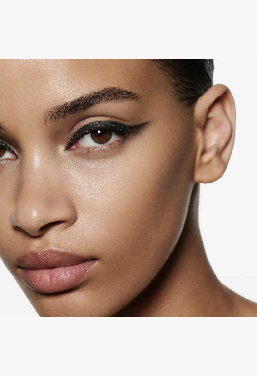 Model wearing a sharp black winged eyeliner look created with GLAM MODA Eye Wardrobe eyeshadow palette