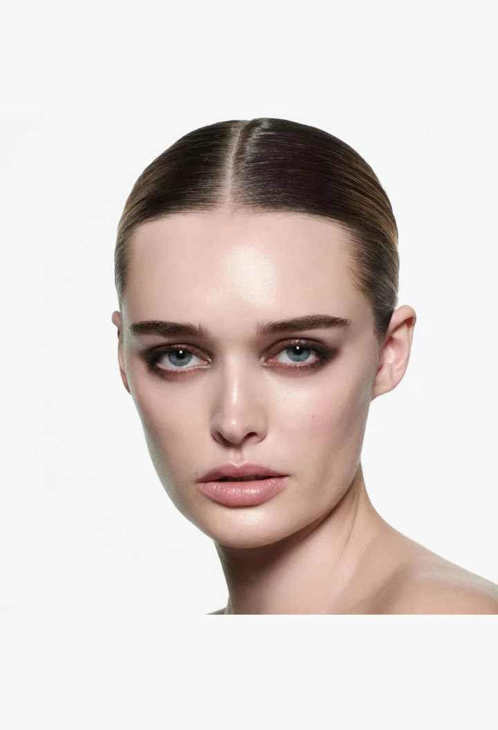 Model wearing a smoky brown eyeshadow look created with the GLAM MODA Eye Wardrobe Multi-Finish Eyeshadow Palette