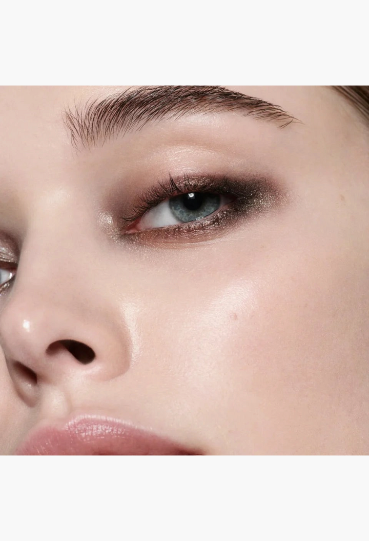 Close-up of a model wearing GLAM MODA Eye Wardrobe Night Flash eyeshadow palette with shimmering and matte brown tones