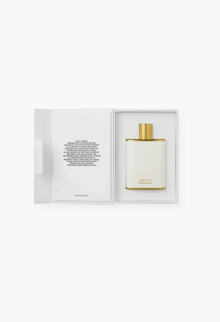 GLAM MODA Suite 302 Eau de Parfum in a white enamel bottle with gold cap, presented in an open gift box.