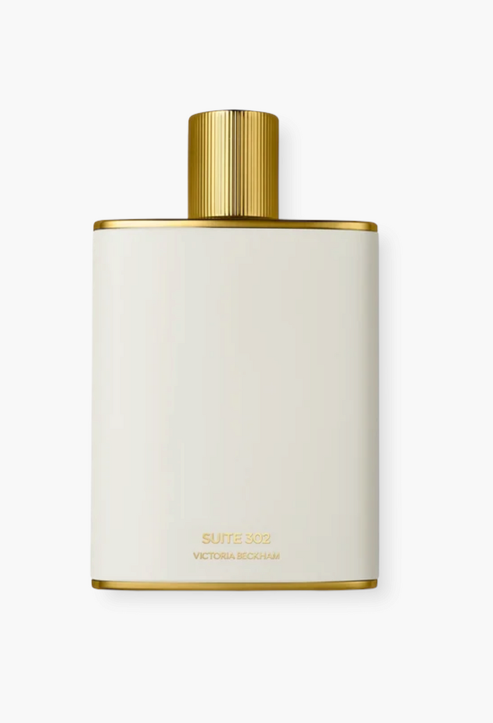 GLAM MODA Suite 302 Eau de Parfum in a white enamel bottle with a gold cap and gold trim details.