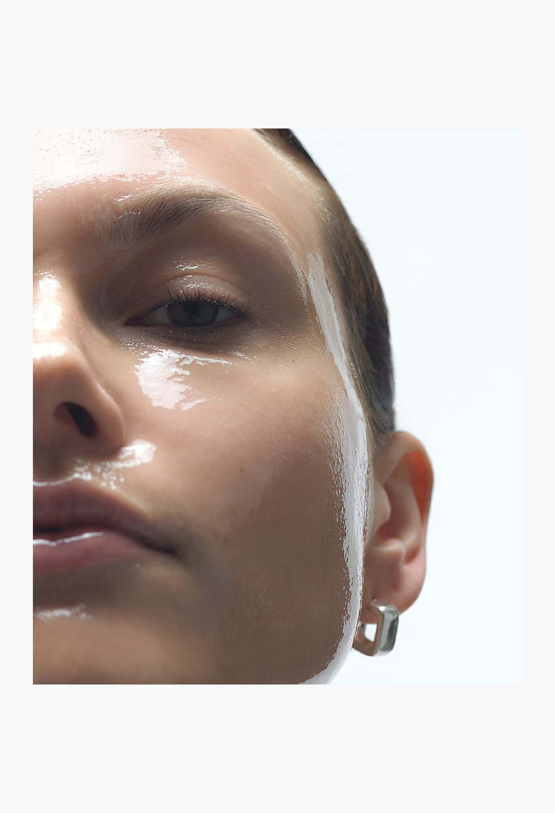 GLAM MODA Precision Peel treatment applied to a woman's face, showing a smooth, radiant, and hydrated complexion.
