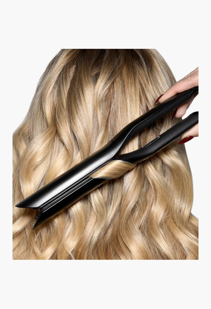 GLAM MODA Sculpt hair styler with black infinity plates gliding through blonde wavy hair for a smooth finish