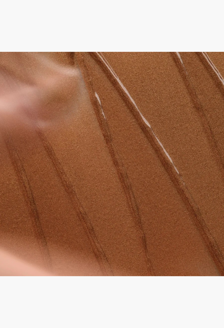 GLAM MODA Hyper Shine Lite Pigment swatch showing a creamy, radiant bronze shimmer texture on a white background.