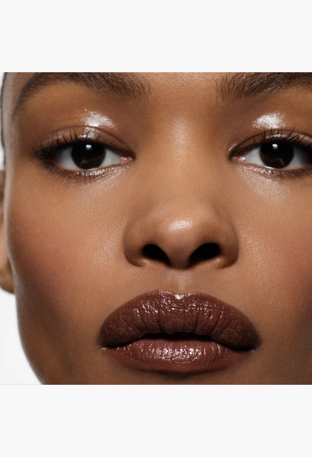 GLAM MODA Posh Lipstick in Spice, a creamy ginger-toned moisturizing lipstick on a model with a glossy finish.
