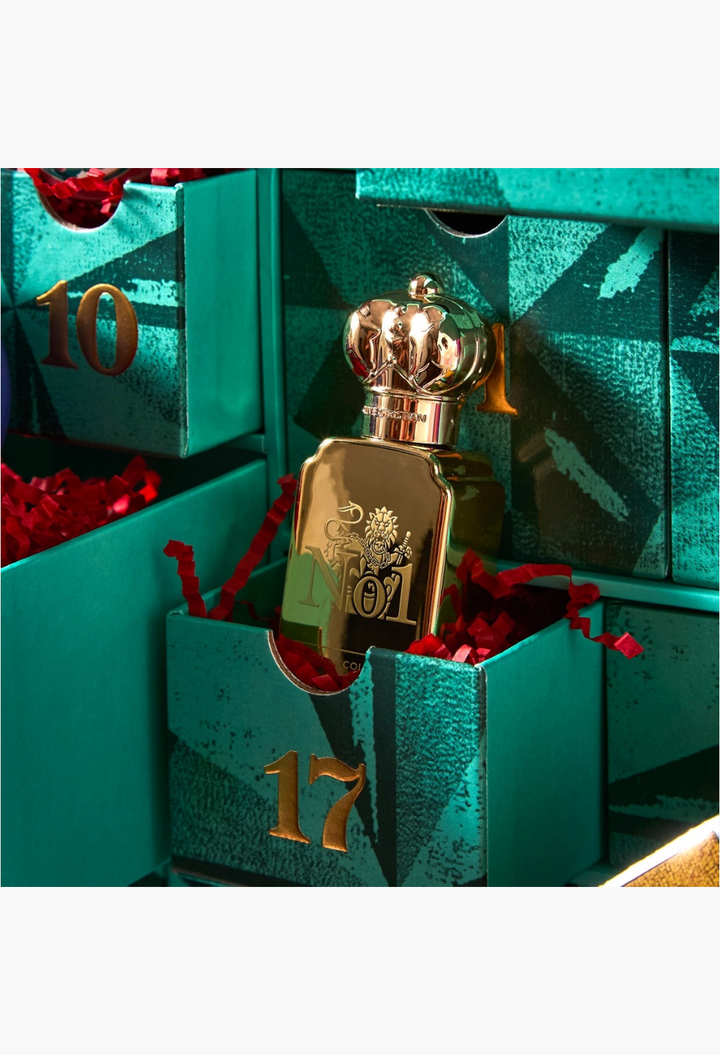 GLAM MODA beauty advent calendar drawer 17 featuring a gold Clive Christian perfume bottle nestled in red paper
