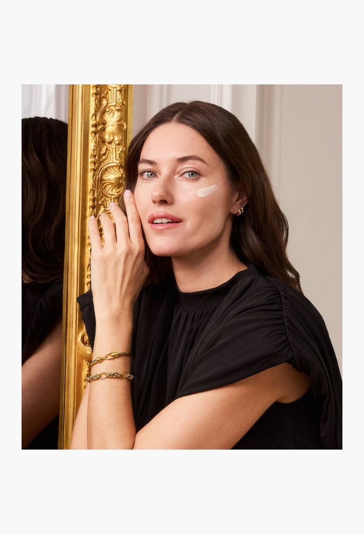 GLAM MODA Restorative Cream Supreme applied to a woman's cheek for intensive hydration and anti-ageing treatment.