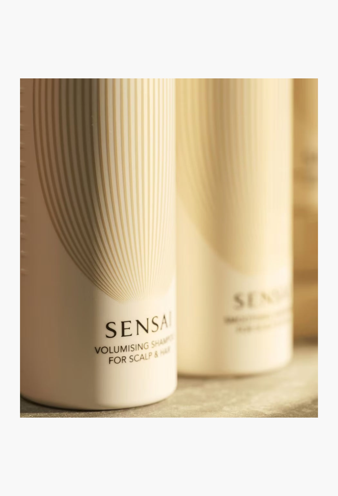 GLAM MODA SENSAI Volumising Shampoo in a beige bottle with gold striped design for hair volume and lift