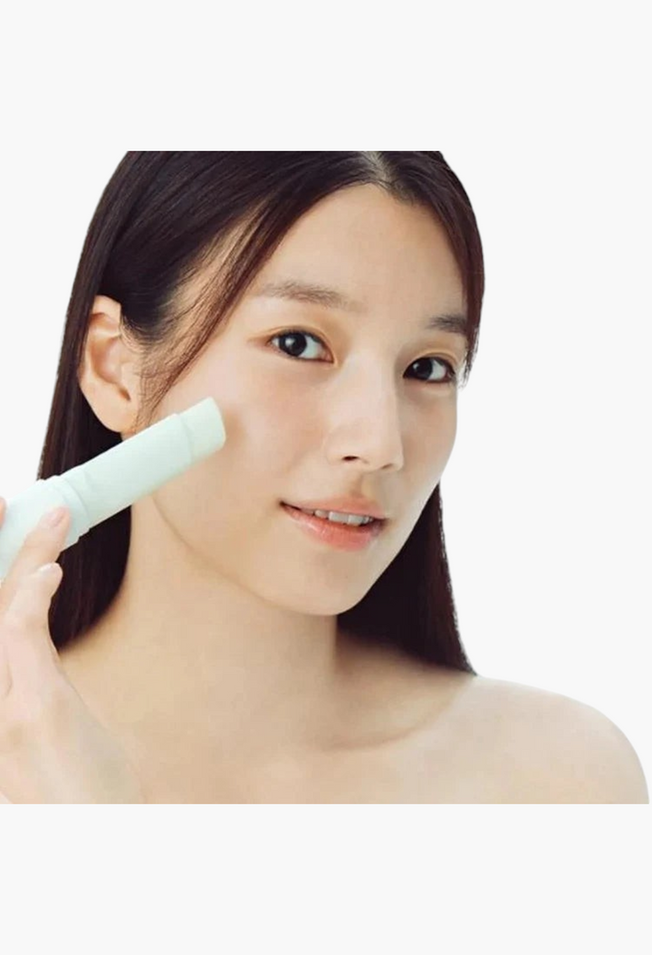 GLAM MODA model applying Dinsee vegan 3-in-1 sunscreen stick with SPF50+ for brightening and firming skin care