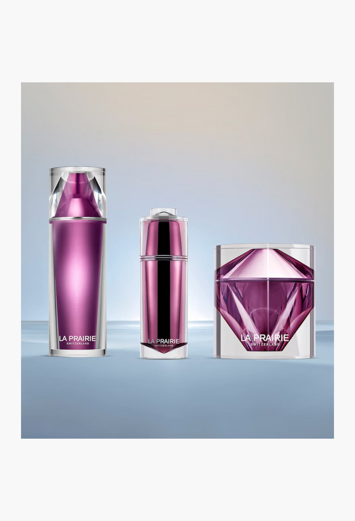 GLAM MODA La Prairie Platinum Rare skincare set featuring purple metallic bottles and a faceted cream jar