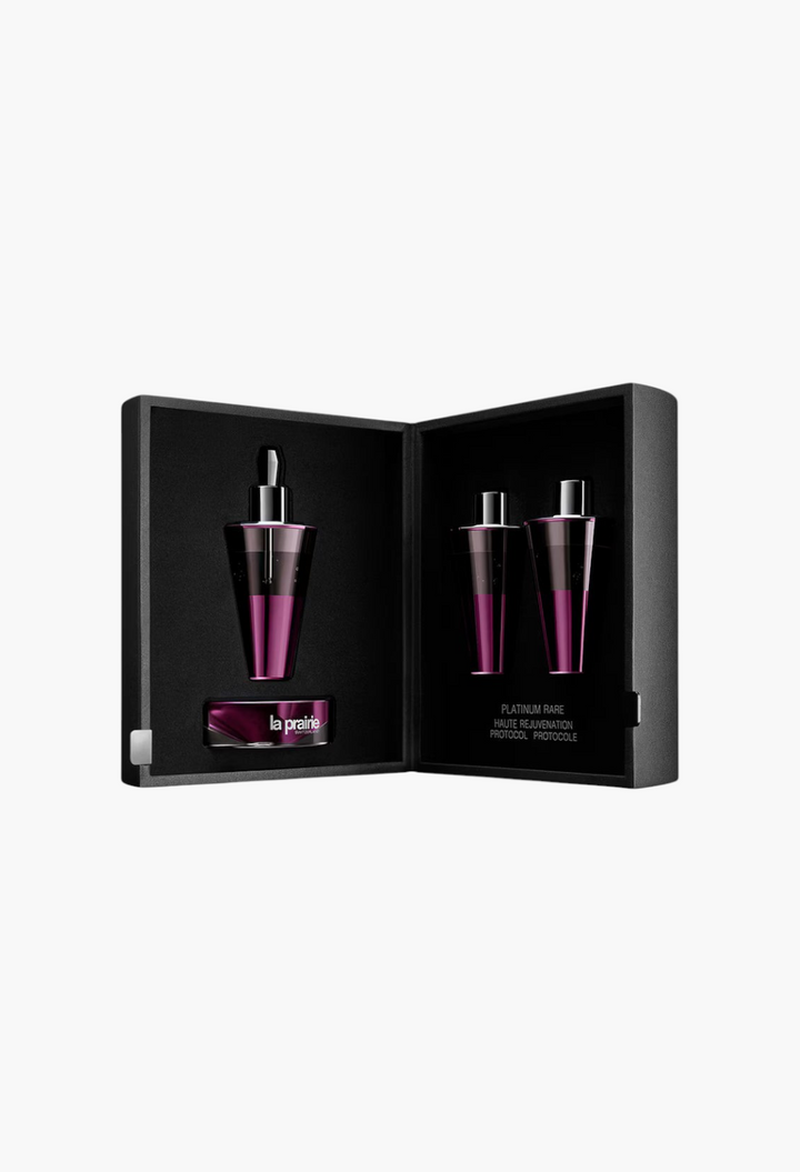 GLAM MODA La Prairie Platinum Rare Haute-Rejuvenation Protocol set with three purple serum vials in a black case.