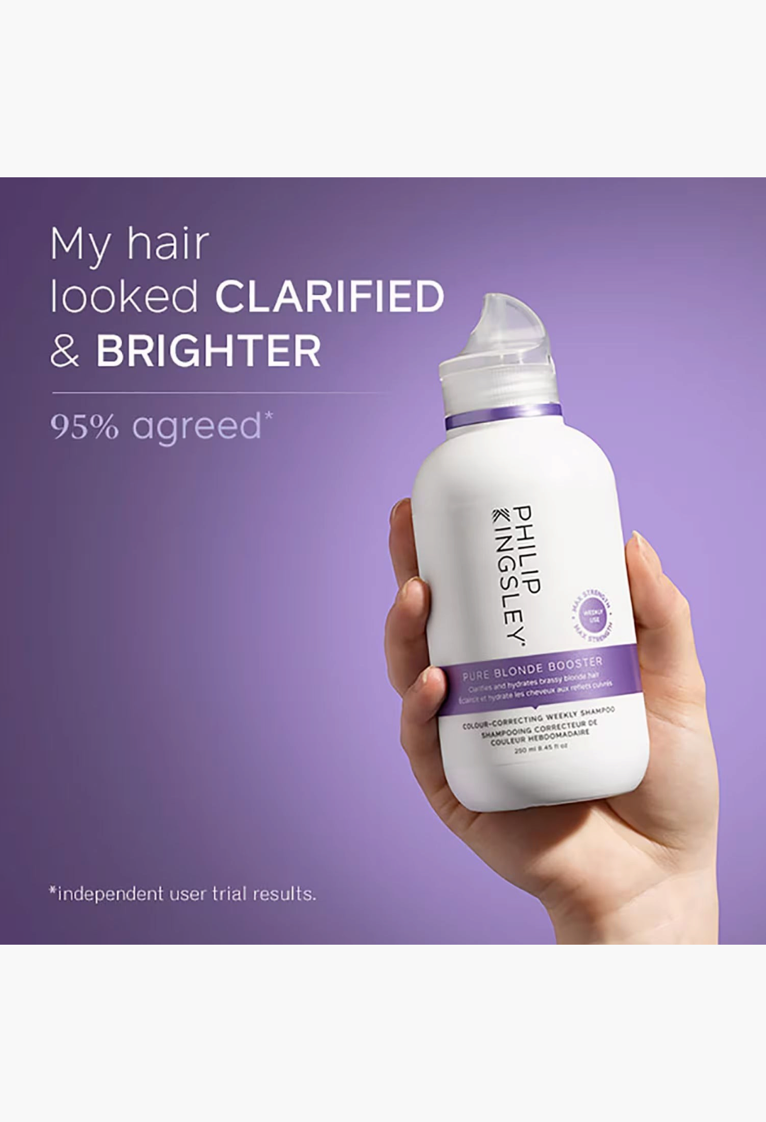 GLAM MODA Philip Kingsley Pure Blonde Booster Shampoo bottle held in hand against a purple background