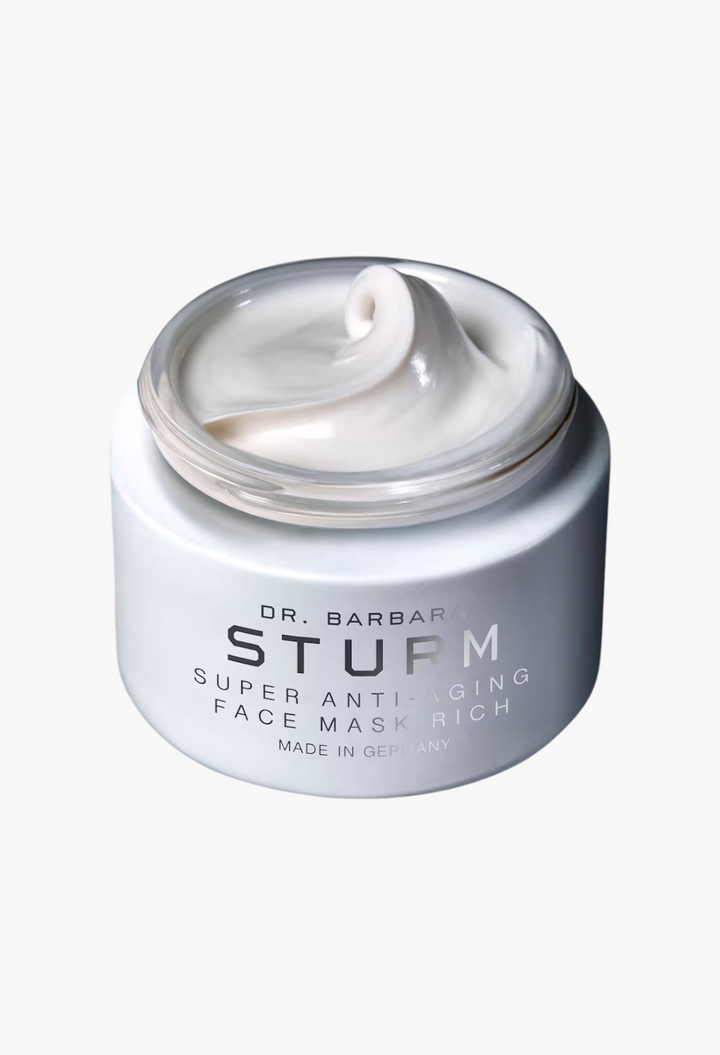 GLAM MODA Dr. Barbara Sturm Super Anti-Aging Face Mask Rich in a white jar with a creamy white texture.