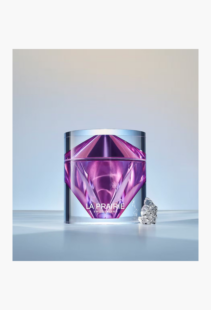 GLAM MODA La Prairie Platinum Rare Haute-Rejuvenation Cream in a faceted purple glass jar with a metallic accent.