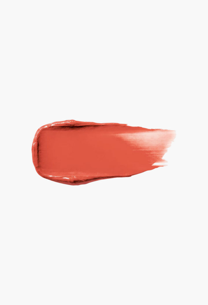 GLAM MODA Make Me Blush cream blush swatch in a vibrant coral-red shade with a smooth, dewy texture.