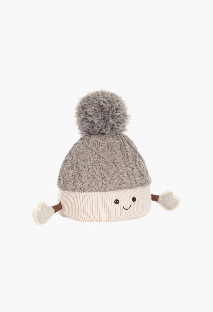 GLAM MODA Amuseables Pomilly plush toy featuring a grey cable-knit hat with a fluffy pom-pom and a smiling face.