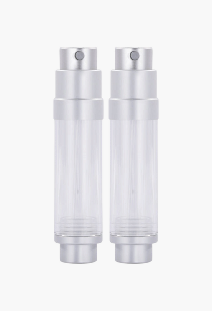 GLAM MODA refillable perfume atomizer spray bottles in silver and clear, compact travel-sized fragrance containers.