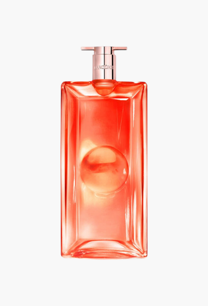 GLAM MODA Lancôme Idôle Peach 'N Roses Eau de Parfum in a slim, rectangular peach-tinted glass bottle