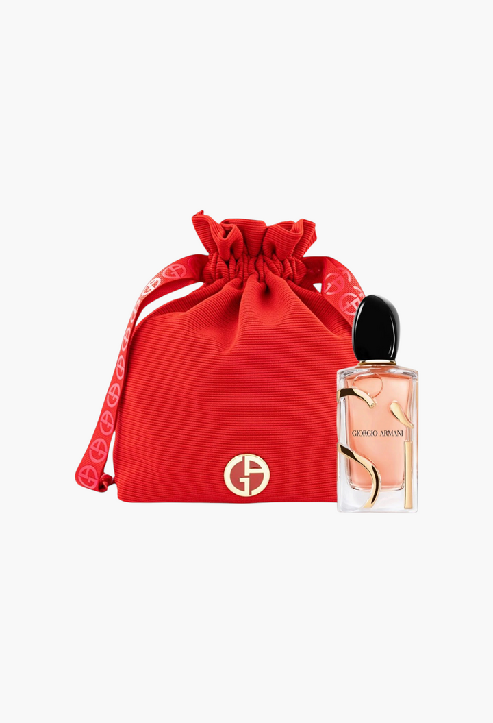 GLAM MODA Armani Beauty Si Intense refillable perfume bottle next to a red drawstring pouch with gold logo