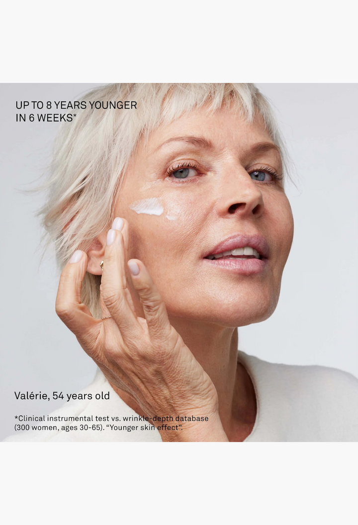 GLAM MODA La Cream Duo Skin Longevity Crème applied to the cheek of a mature woman for anti-aging skin rejuvenation.
