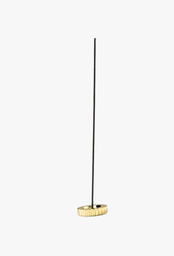 GLAM MODA Desertland incense stick in a sleek gold metallic holder for a relaxing home fragrance experience.