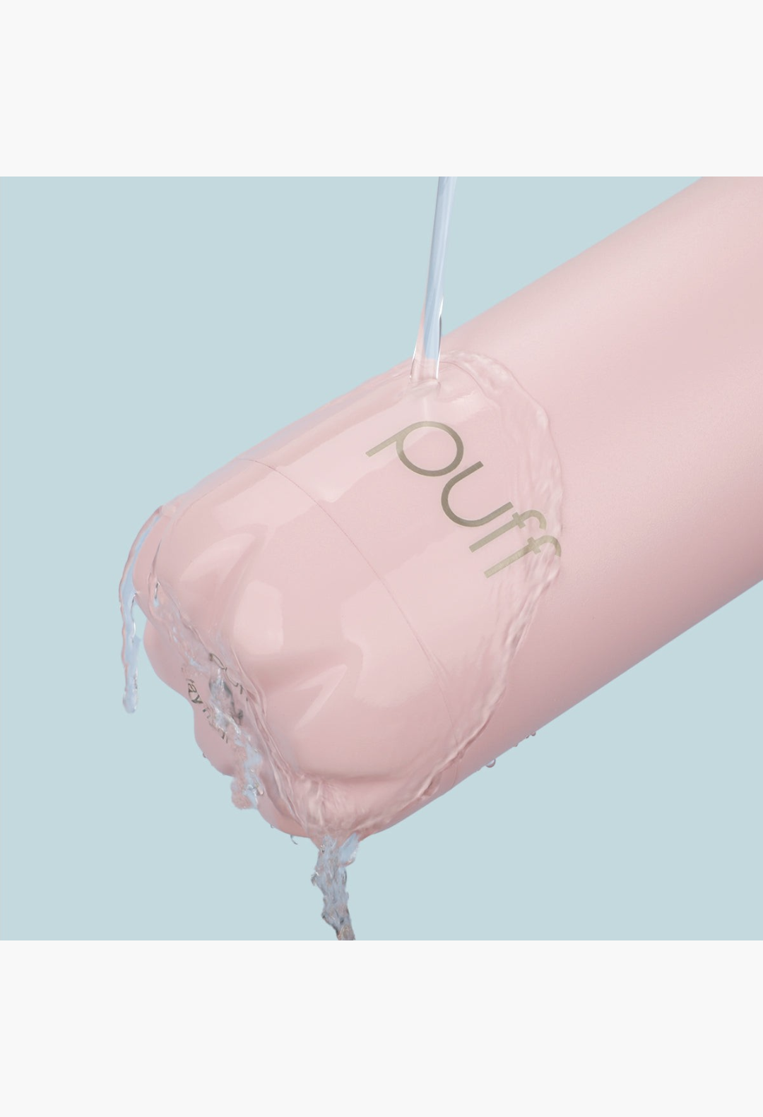GLAM MODA matte baby pink insulated stainless steel Puff bottle being rinsed with water