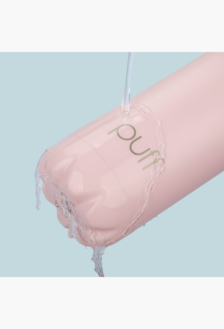 GLAM MODA matte baby pink insulated stainless steel Puff bottle being rinsed with water