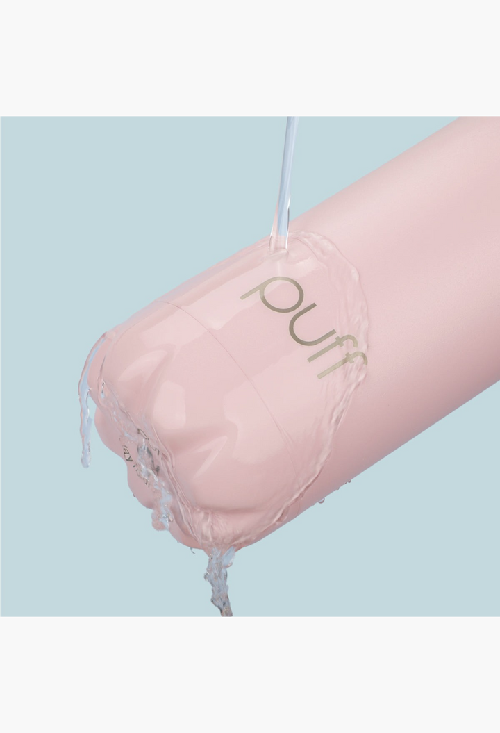 GLAM MODA matte baby pink insulated stainless steel Puff bottle being rinsed with water
