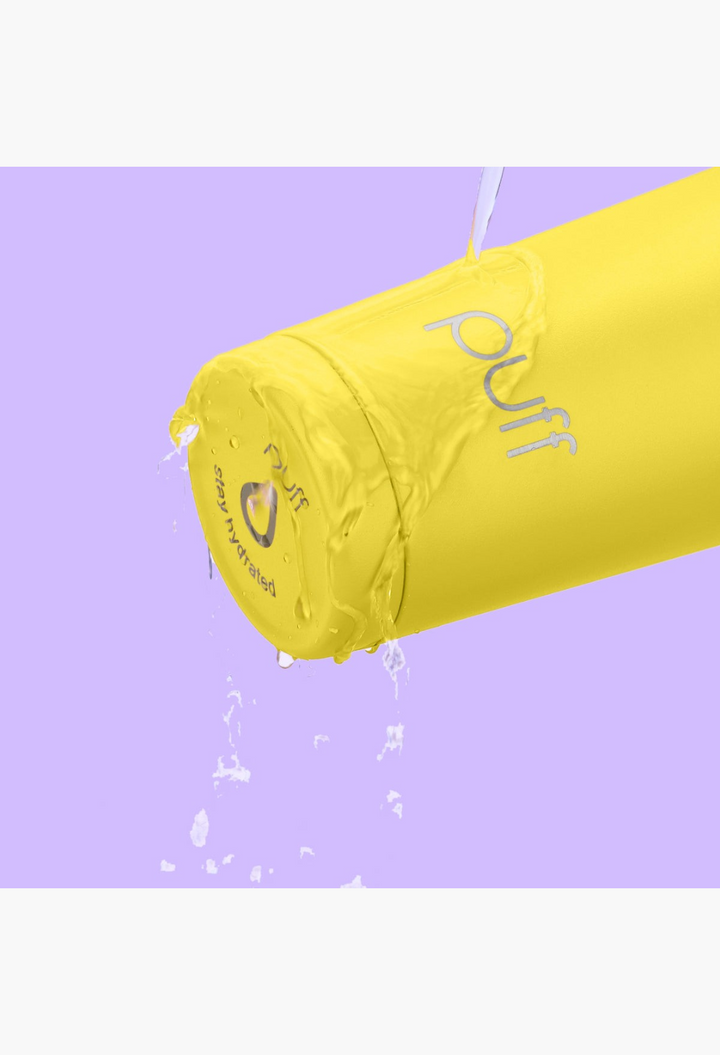 GLAM MODA yellow Puff Shaker stainless steel water bottle with water splashing over the exterior