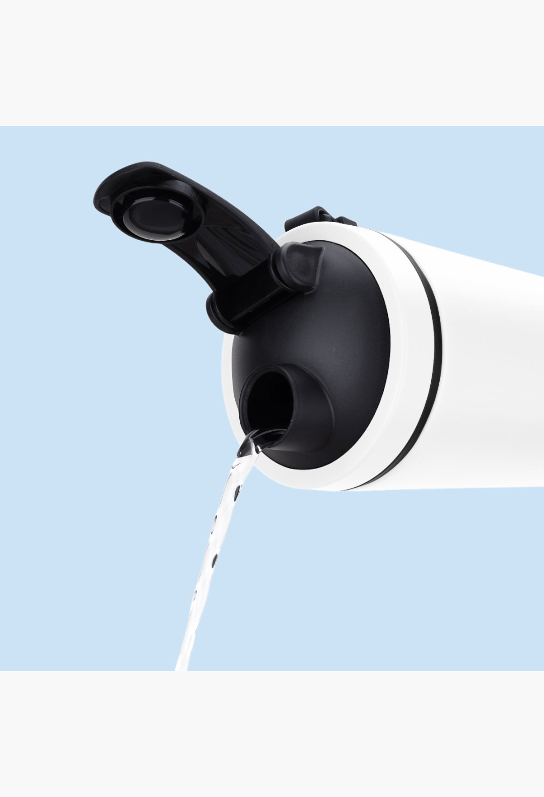 GLAM MODA Matte Shaker bottle with a black vacuum-seal cap pouring water, featuring double-walled stainless steel.