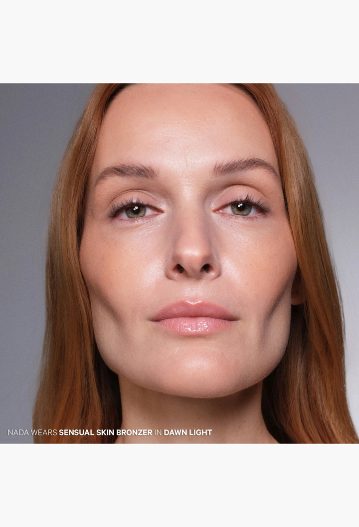 GLAM MODA model wearing The Sensual Skin Bronzer in Dawn shade for a natural sun-kissed glow and sculpted cheekbones.