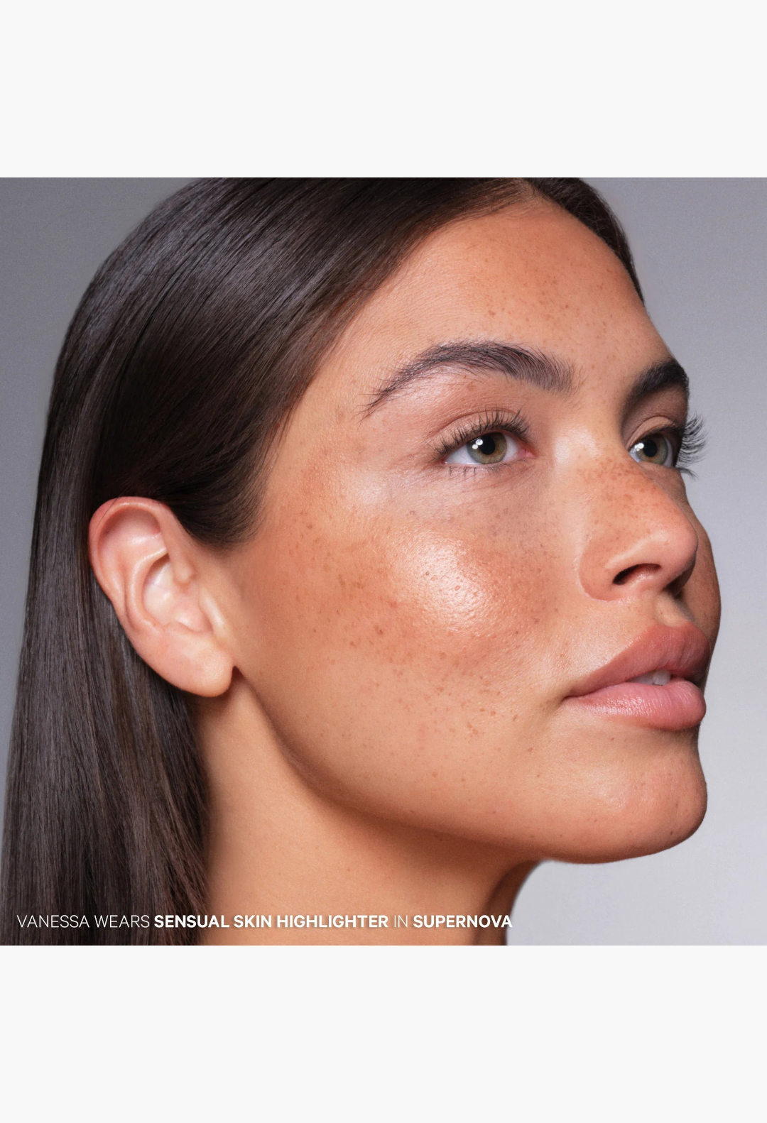 GLAM MODA model wearing Supernova Sensual Skin Highlighter for a natural, glassy, and lit-from-within glow.