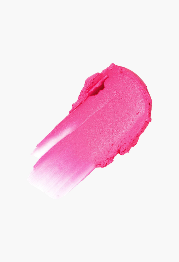 GLAM MODA Sensual Skin Blush in Revealed, a vibrant hot fuchsia cream-to-powder swatch with a smooth finish.