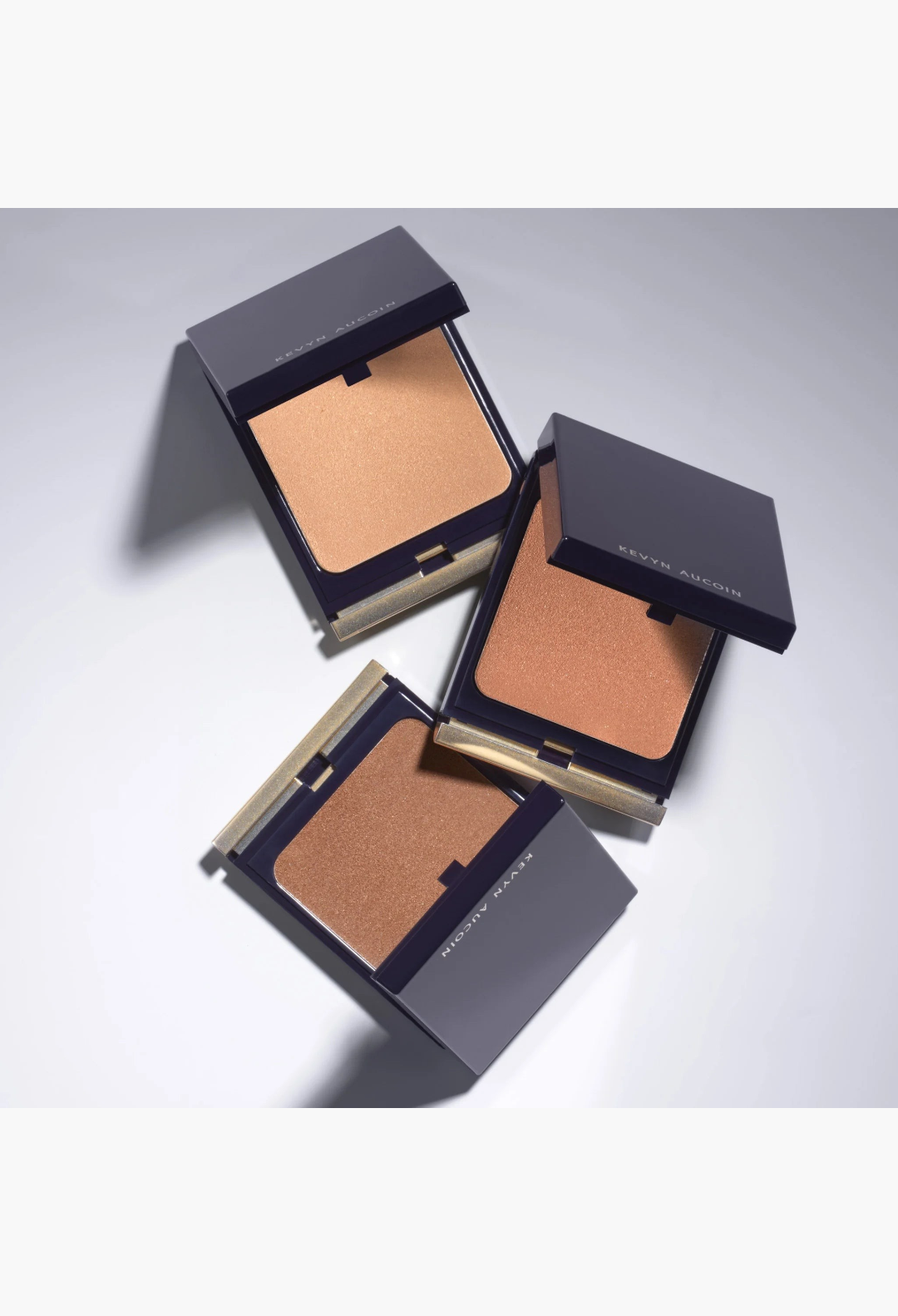 GLAM MODA Kevyn Aucoin Sensual Skin Bronzer trio in three shades of golden tan, bronze, and rich terracotta.