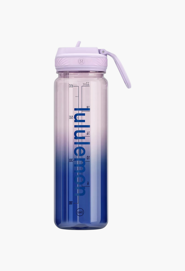 GLAM MODA 24oz clear Tritan water bottle with a purple straw lid, featuring a blue gradient design and carry loop.