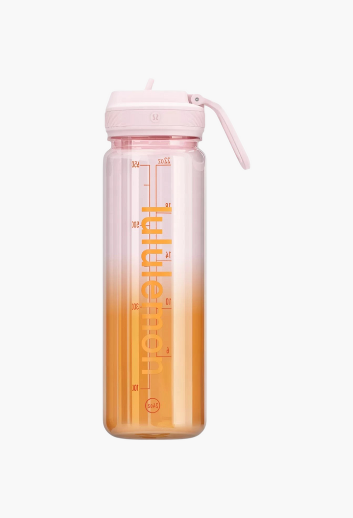 GLAM MODA Back to Life clear 24oz water bottle with a pink straw lid and orange-to-clear gradient design.