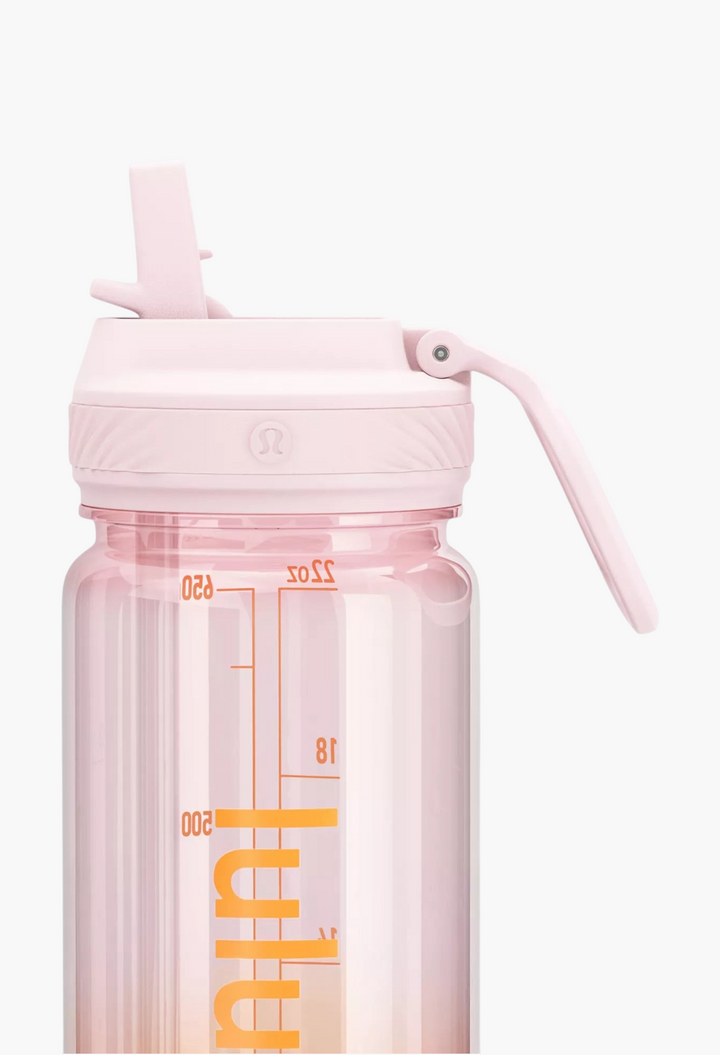 GLAM MODA Back to Life clear light pink water bottle with a leakproof straw lid and volume measurement markings.